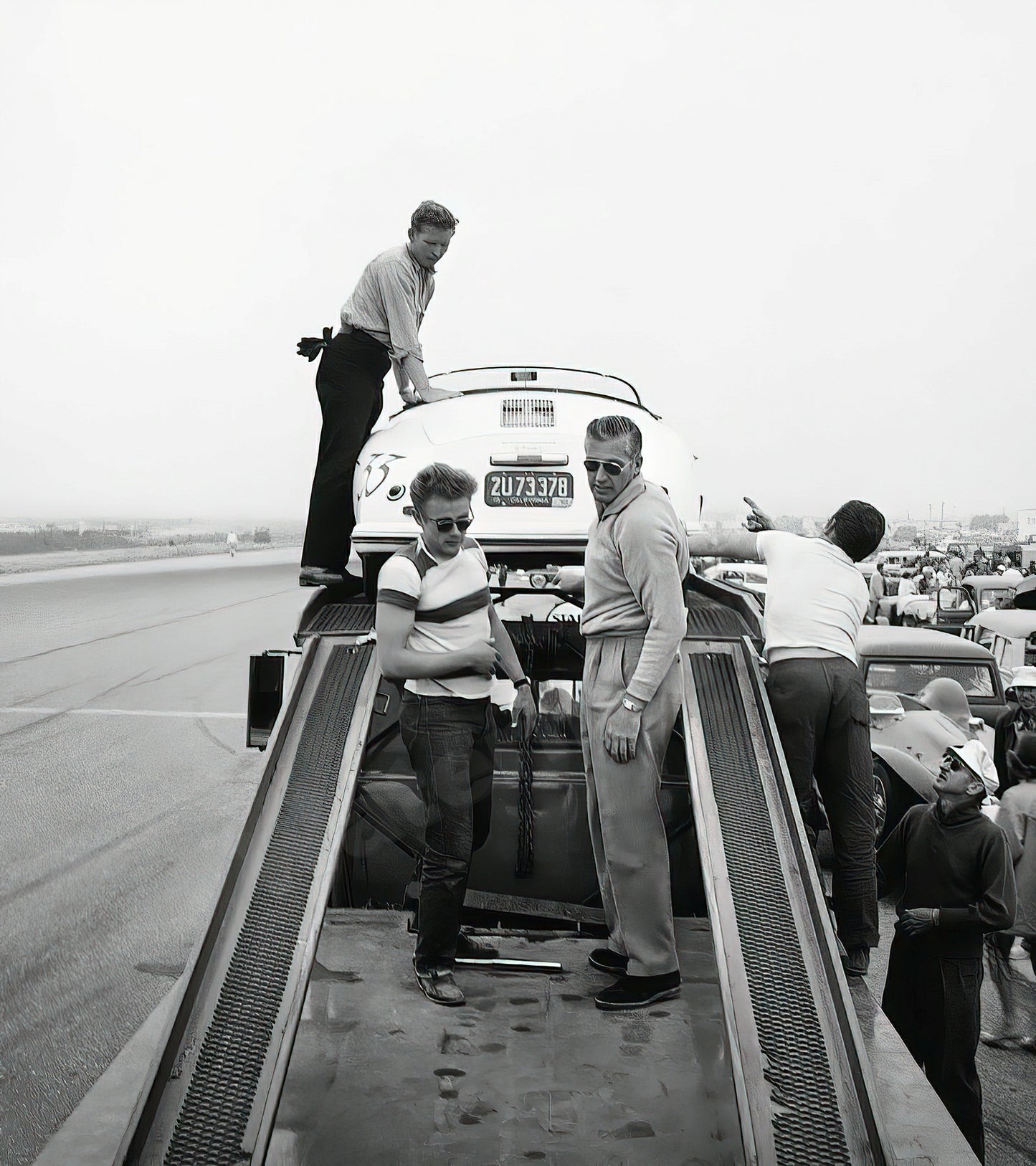 James Dean Standing With Porsche At Car Rally B&W Photo - Celebrity Actors