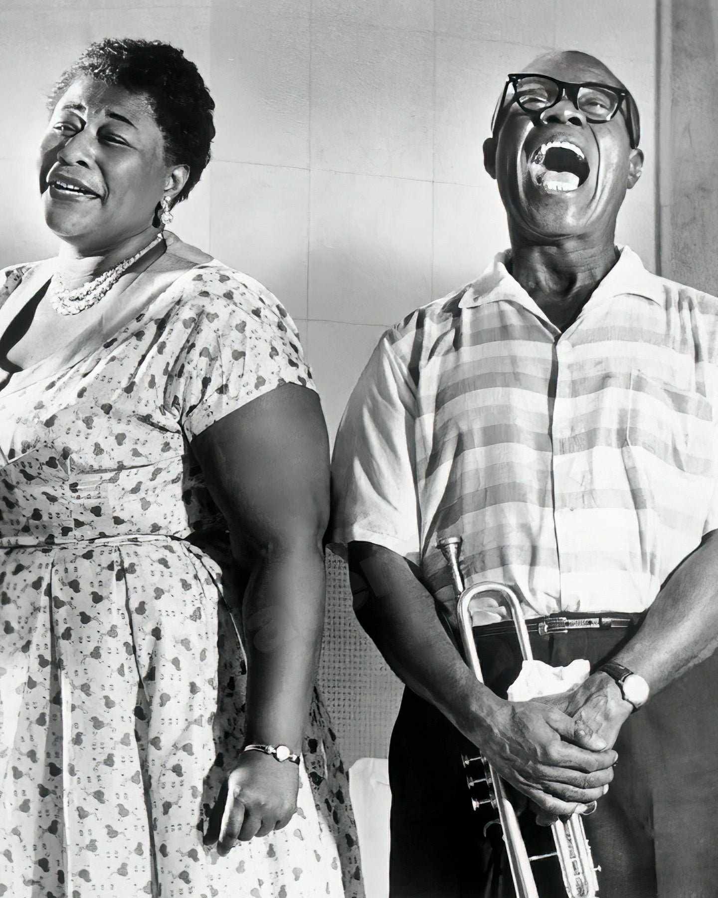 Ella Fitzgerald and Louis Armstrong posed smiling for the camera, circa 1956 - Celebrity Musicians