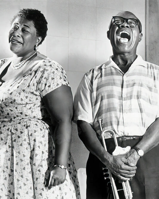 Ella Fitzgerald and Louis Armstrong posed smiling for the camera, circa 1956 - Celebrity Musicians